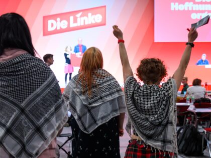 10 May 2025, Saxony, Chemnitz: Delegates with so-called Palestinian scarves are in the hal