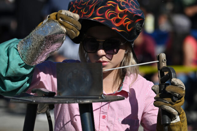 US-POLITICS-ENVIRONMENT-OIL A welder competes in the "Oilfield Skills Competition" during the Oildorado fest