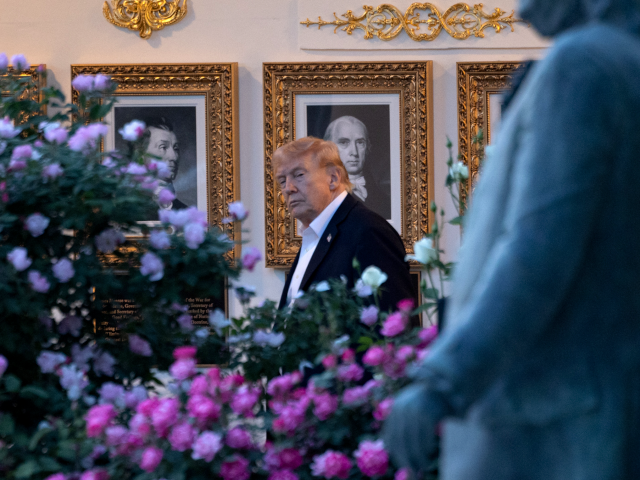 WASHINGTON, DC - MAY 03: President Donald Trump looks toward a statue of Benjamin Franklin