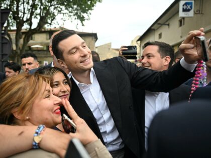 French far-right party Rassemblement National (RN) president Jordan Bardella takes a selfi