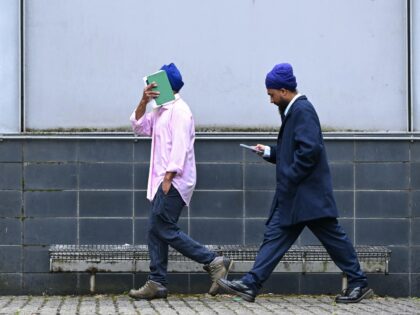 Moga Singh (L), the father of Vickrum Digwa who was on June 1 found guilty of killing 18-y