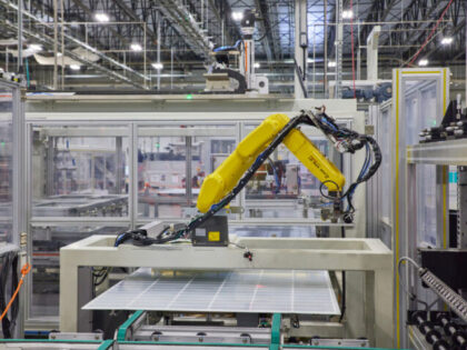 Solar modules move along an automated assembly line at the Hanwha QCells solar panel manuf