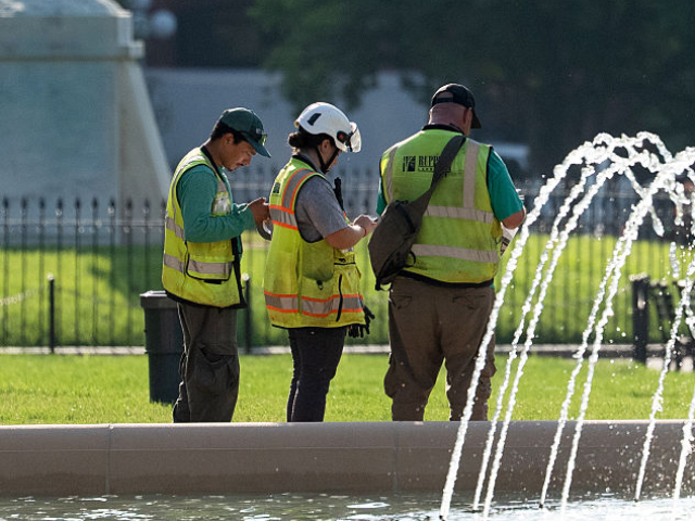 Staff work on Lafayette Park renovations outside the White House in Washington, DC, US, on