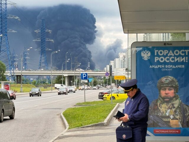 TOPSHOT - Black smoke rises from the area of the Russian oil producer Gazprom Neft's Mosco