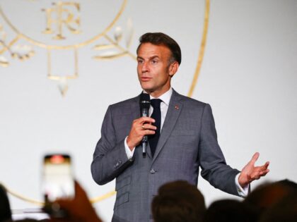 France's President Emmanuel Macron delivers a speech as he welcomes several hundred French