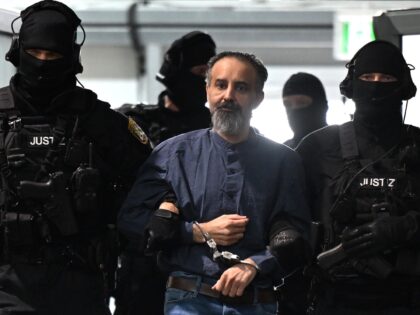 dpatop - 26 June 2026, Saxony-Anhalt, Magdeburg: Court officials are leading the defendant