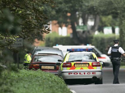 Police block a road due to an outbrake of foot and mouth disease in Chertsey, Surrey, 12 S
