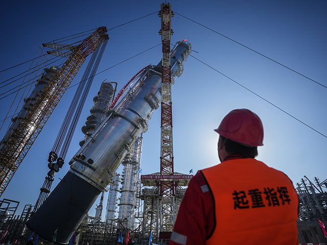 GettyImages2201758508 A staff member directs the installation of a raffinate tower of aromatics complex at the c