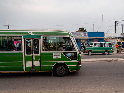Commuters ride on buses in Brazzaville on March 3, 2026, ahead of the country's March 15 p