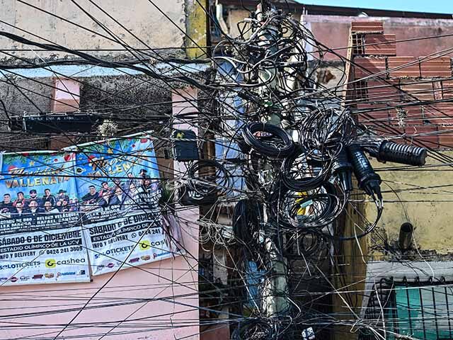GettyImages2275677809 Power lines are pictured on a street at Petare neighborhood in Caracas on May 14, 2026. (P