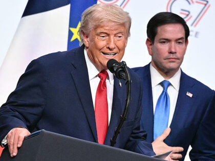 US President Donald Trump (L) addresses the media alongside US Secretary of State Marco Ru