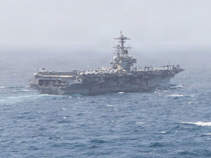 USS George H.W. Bush (CVN 77) sails in the Arabian Sea. Two aircraft carriers continue to