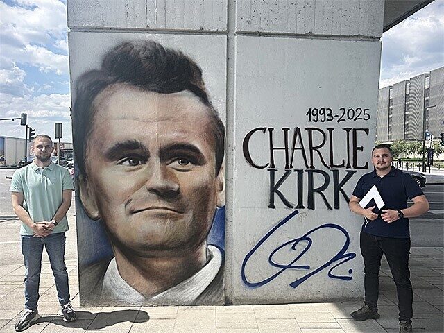 Dusan Curich and Dario Radich of Balkanwatch.com stand next to their mural honoring Charli