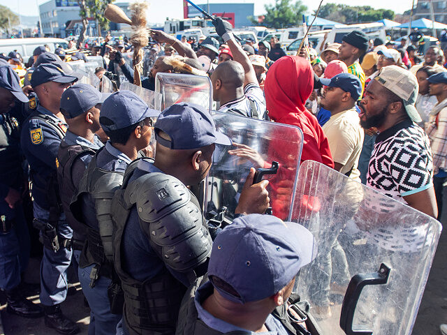 CAPE TOWN, SOUTH AFRICA - MAY 30: Public Order Police (POPS) prevent protestors from enter
