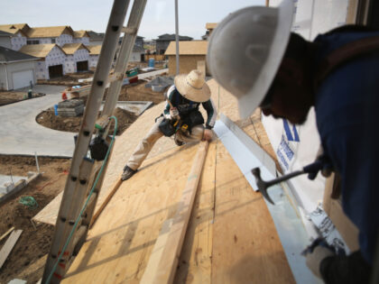 Mexican immigrants work on a housing construction site on May 3, 2013 in Denver, Colorado.