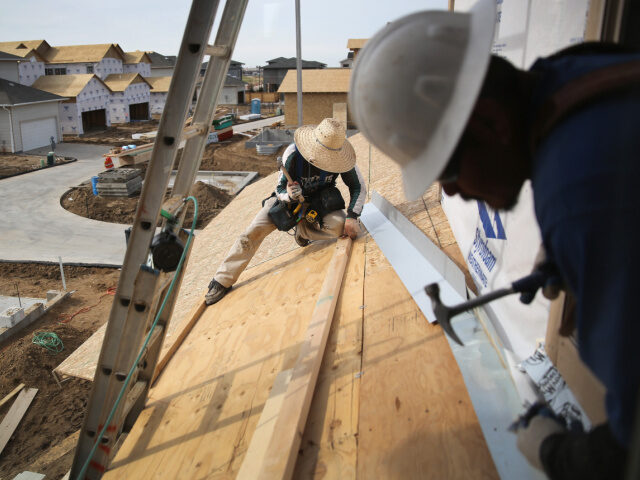 Mexican immigrants work on a housing construction site on May 3, 2013 in Denver, Colorado.
