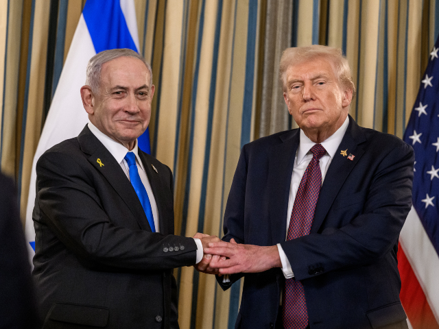 President Donald Trump and Israeli Prime Minister Benjamin Netanyahu shake hands after joi
