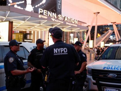 NYPD police officers are seen outside Penn Station in New York on June 7, 2026. Five peopl