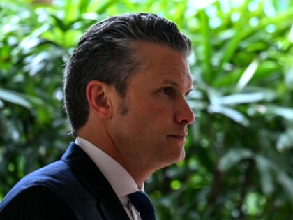 US Secretary of Defense Pete Hegseth (C) walks after a bilateral meeting with Malaysia