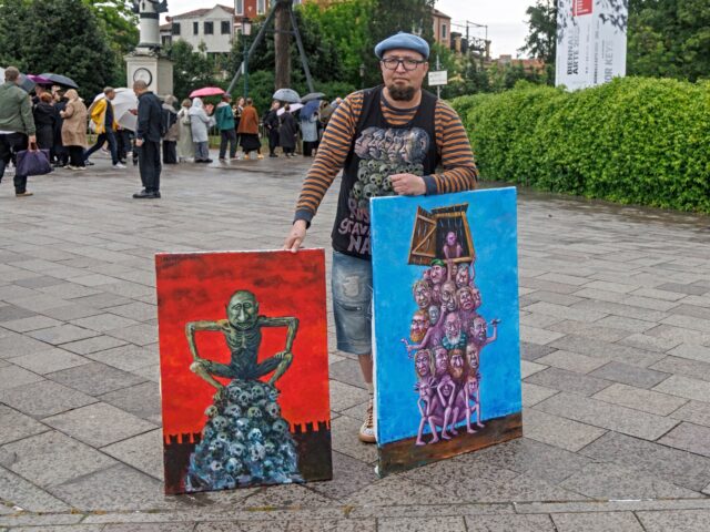 VENICE, ITALY - MAY 06: Russian dissident Semyon Skrepetsky protests at the Giardini, at t