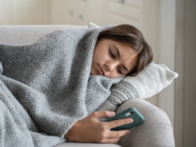 Social media addict scrolls TikTok