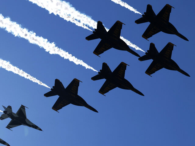 Thunderbirds and Blue Angels _ airshow The U.S. Air Force Thunderbirds and U.S. Navy Blue Angels conduct a flyover on June 12, 20