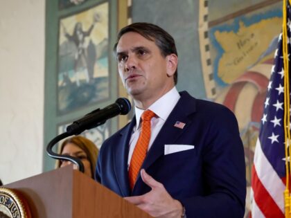 Acting U.S. Attorney General Todd Blanche speaks during a ceremony to honor the victims of