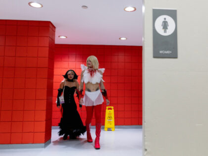 Sadie Schreiner (R) leaves the Women's restroom with her partner Ace Quiampang during