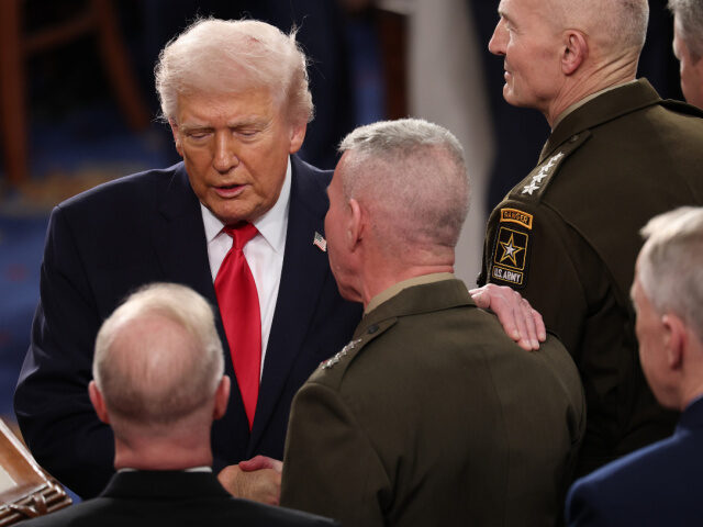 U.S. President Donald Trump greets members of the Joint Chiefs of Staff as he arrives to d