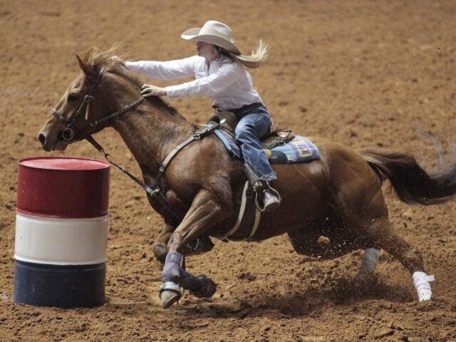 barrell racing (1) Andrea Wolf rides in the Championship Barrel Race in the World's Original Indoor Rodeo in