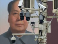 Surveillance cameras are seen near a portrait of former Chairman Mao Zedong at Tiananmen G
