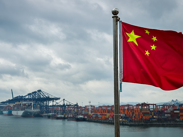china-shipping-cargo-getty SHENZHEN, CHINA - APRIL 12: A Chinese national flag is seen in the foreground with contain