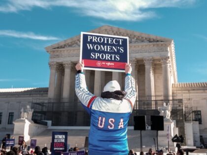 A demonstrator holds a sign outside the US Supreme Court in Washington, DC, US, on Tuesday