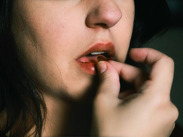 taking medication pill