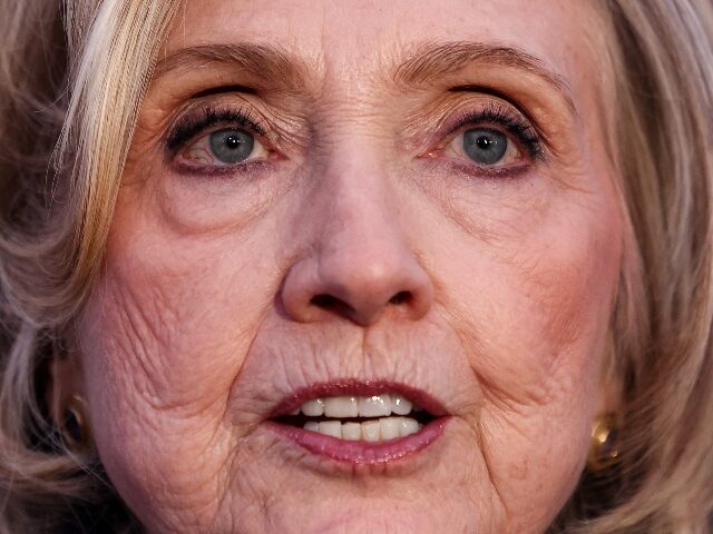 TOPSHOT - Former US Secretary of State Hillary Clinton speaks to the press after her a dep
