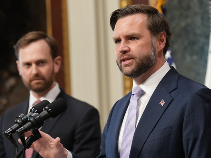 FTC Chairman and Task Force Vice Chair Andrew Ferguson, left, listens as Vice President JD