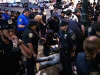 NEW YORK, NEW YORK - JUNE 8: NYPD officers detain a person as they move back New York Knicks fans outside of a watch party at Bryant Park for Game 3 of the NBA Finals between New York Knicks and San Antonio Spurs on June 8, 2026 in New York City. The New York City Police Department and Secret Service cancelled an NBA Finals watch party near Madison Square Garden, with fans advised to arrive at least two hours before Monday's game due to heightened security for U.S. President Donald Trump's attendance. (Photo by Adam Gray/Getty Images)