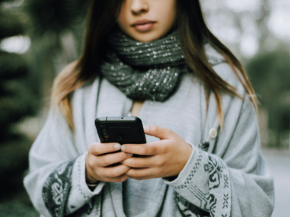 Young woman holding a smartphone