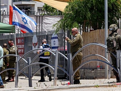 Israeli security forces gather at the site of a suspected shooting attack in the town of T