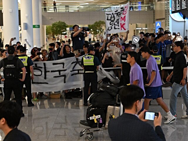 South Korea's football team members arrive following the team's elimination in the group s