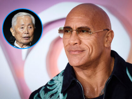 US actor Dwayne Johnson poses on the red carpet upon arrival for the UK Premier of "M