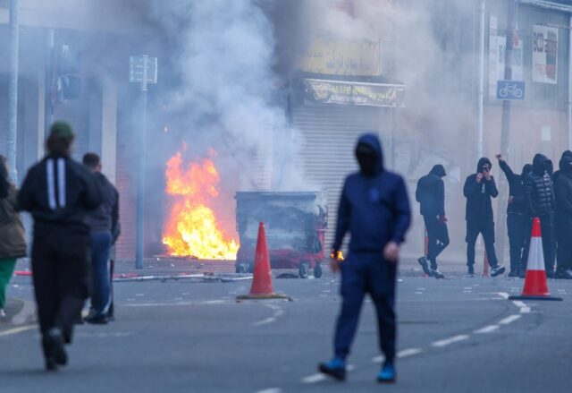 A building is set alight in the Sandy Row area of Belfast city centre, Northern Ireland