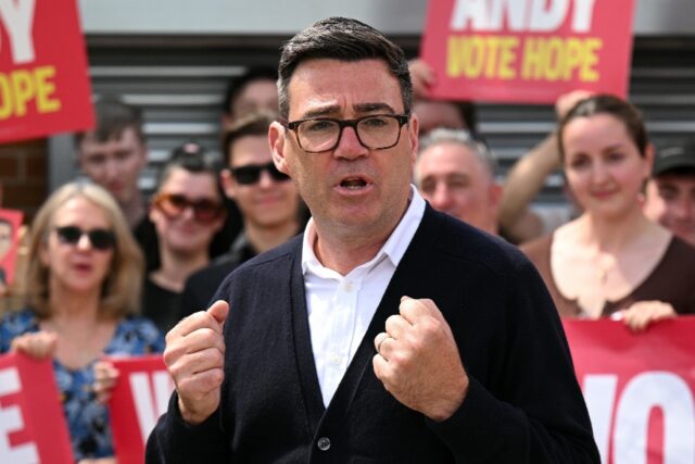 Labour party candidate Andy Burnham addresses supporters outside the Labour party campaign