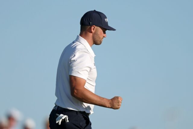 Leader Wyndham Clark of the United States pumps his fist after a par save in the third rou