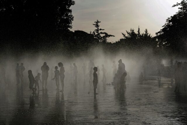 People off in a water fountain in Spain