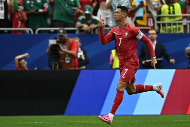 Portugal forward Cristiano Ronaldo celebrates after scoring his team's first goal in