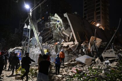 Rescuers searched rubble collapsed buildings for survivors in Caracas following massive tw