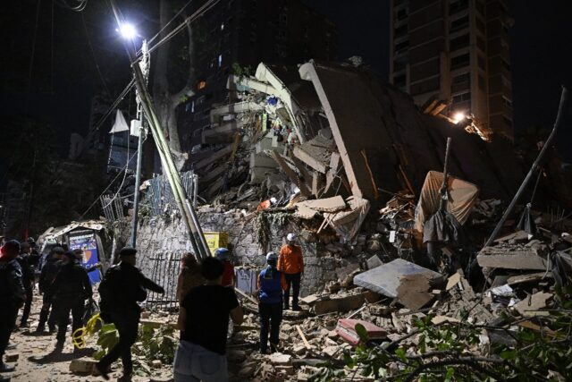 Rescuers searched rubble collapsed buildings for survivors in Caracas following massive tw
