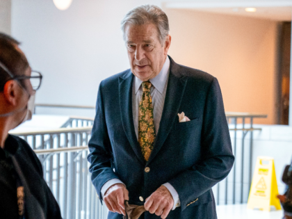 FILE - Paul Pelosi, right, the husband of House Speaker Nancy Pelosi, of California, follo
