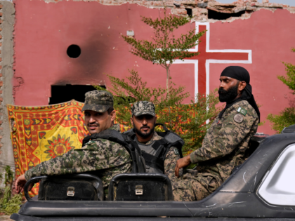 Paramilitary troops patrol after an angry Muslim mob attacked a Christian area in Jaranwal